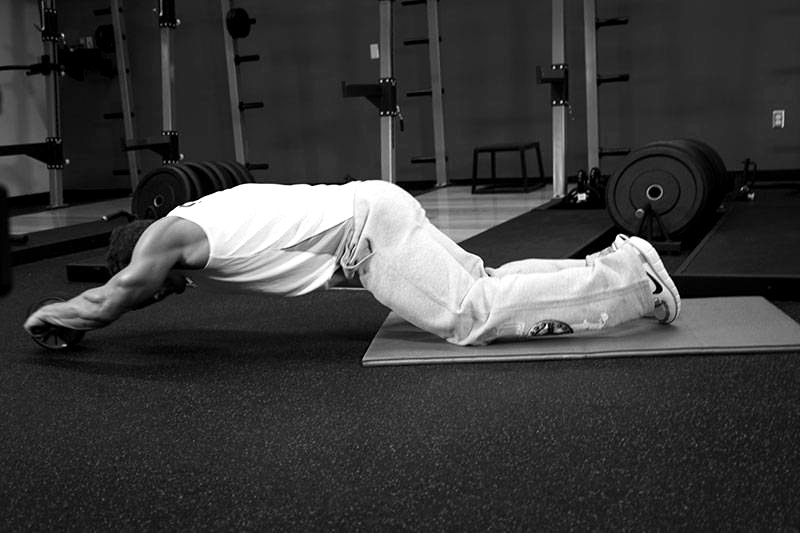 Ab Wheel Rollout — end position demonstration photo