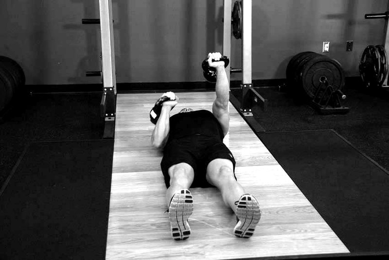 Alternating Floor Press — end position demonstration photo