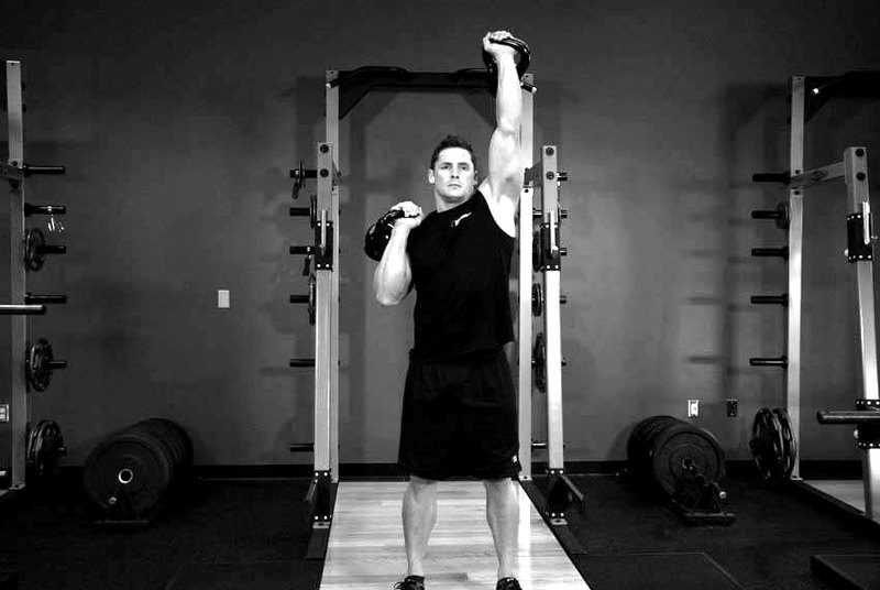 Alternating Kettlebell Press — end position demonstration photo