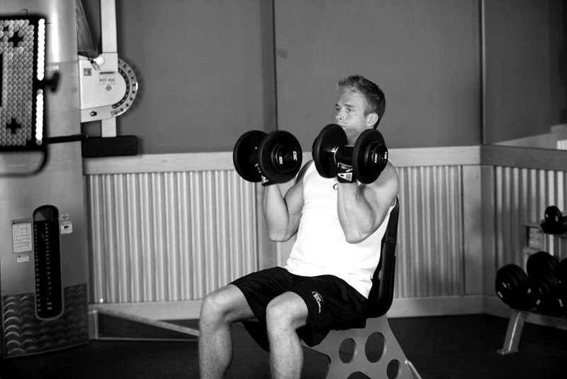 Arnold Dumbbell Press — start position demonstration photo
