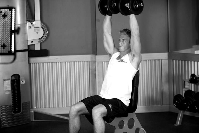 Arnold Dumbbell Press — end position demonstration photo