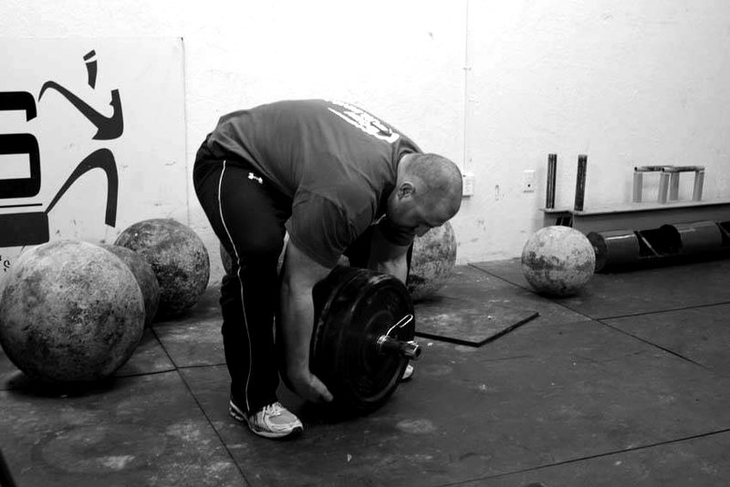 Atlas Stone Trainer — start position demonstration photo