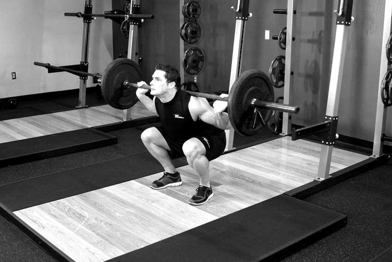 Barbell Back Squat — end position demonstration photo