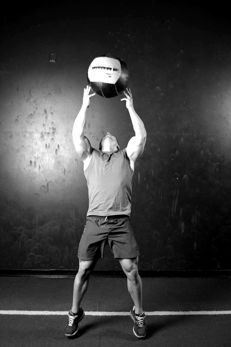 Backward Medicine Ball Throw — end position demonstration photo