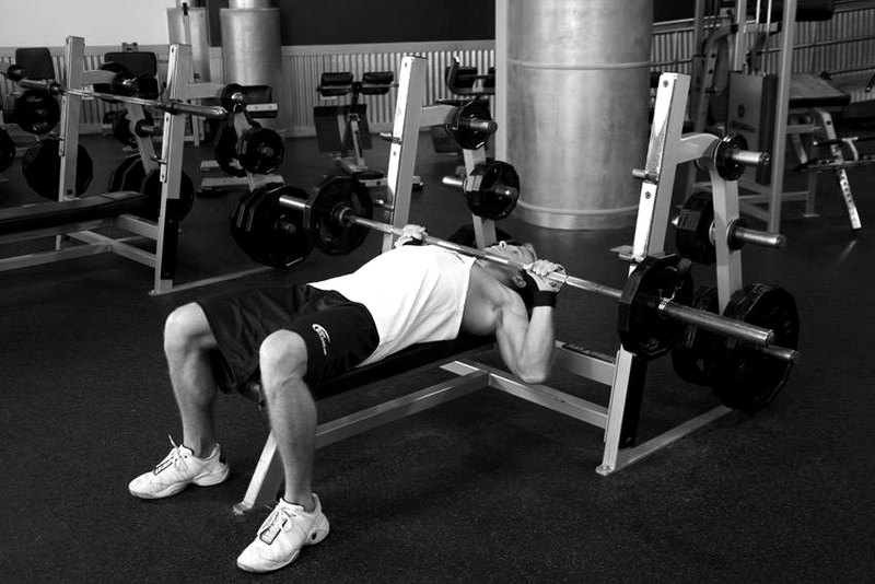 Barbell Guillotine Bench Press — end position demonstration photo