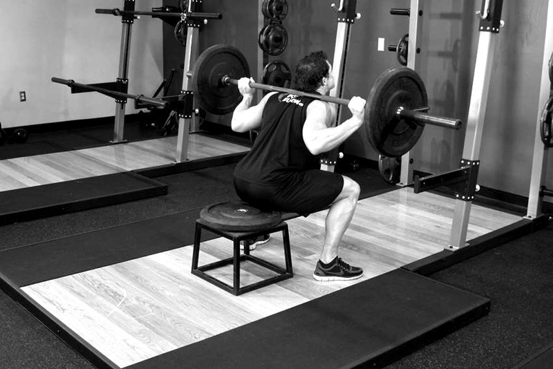 Barbell Squat To A Bench — end position demonstration photo