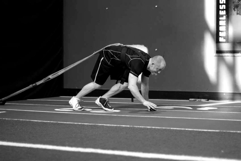 Bear Crawl Sled Drags — start position demonstration photo