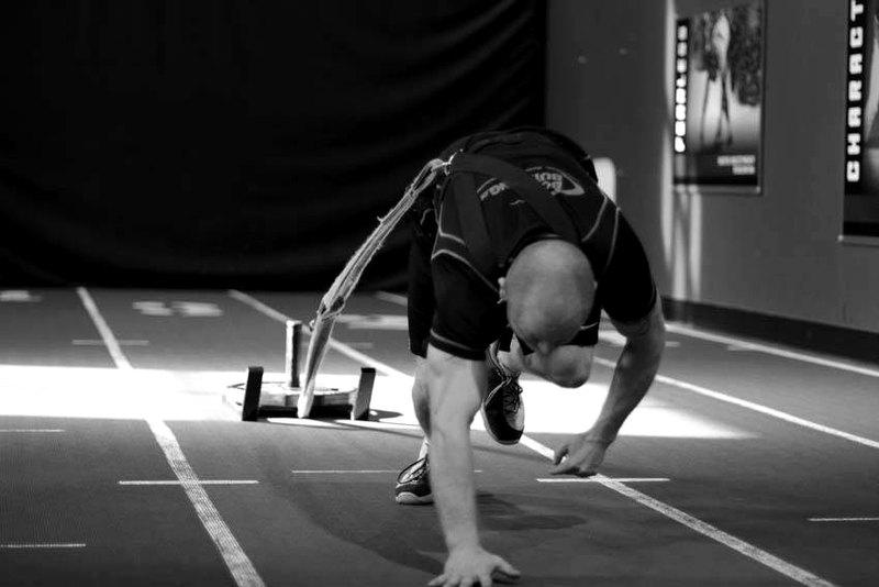 Bear Crawl Sled Drags — end position demonstration photo