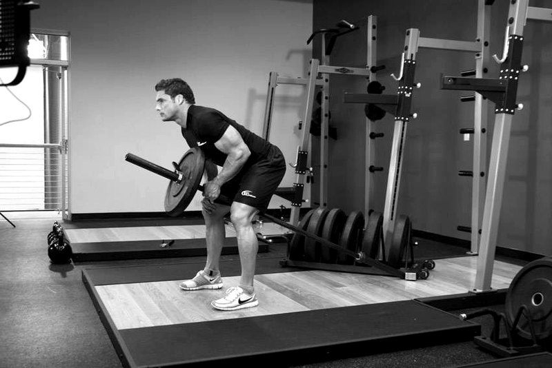 Bent Over One-Arm Long Bar Row — end position demonstration photo