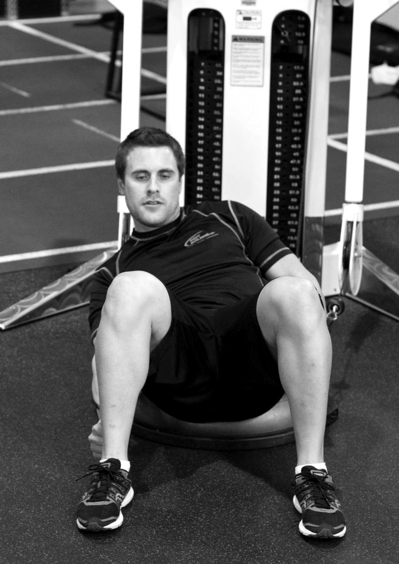 Bosu Ball Cable Crunch With Side Bends — end position demonstration photo