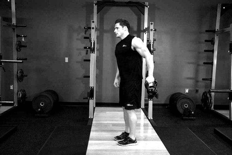 Bottoms-Up Clean From The Hang Position — end position demonstration photo