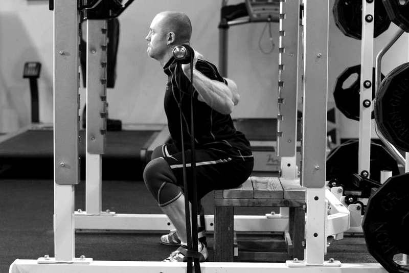 Box Squat with Bands — end position demonstration photo