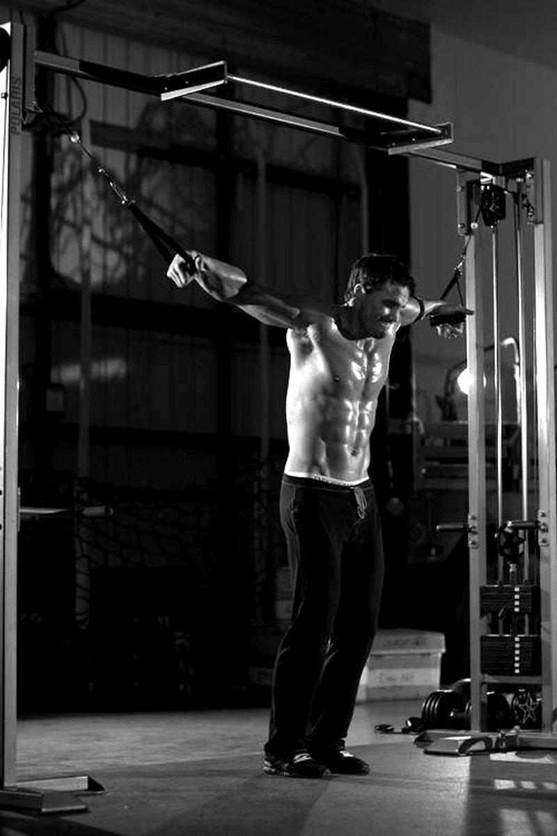 Cable Iron Cross — start position demonstration photo