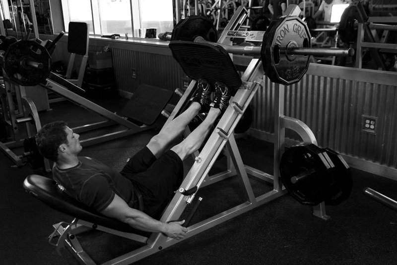 Calf Press On The Leg Press Machine — end position demonstration photo