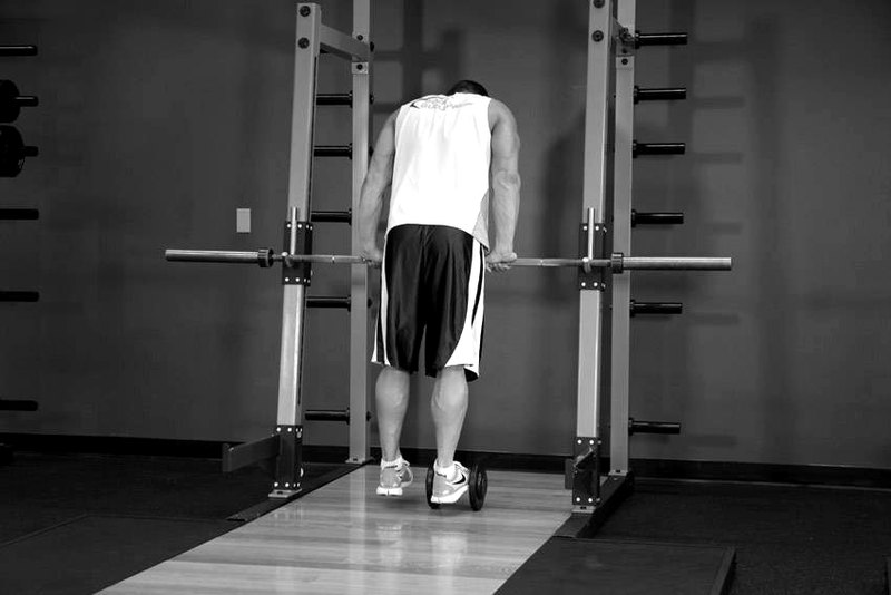 Calf Raise On A Dumbbell — start position demonstration photo