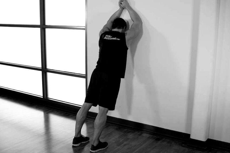 Calf Stretch Elbows Against Wall — start position demonstration photo