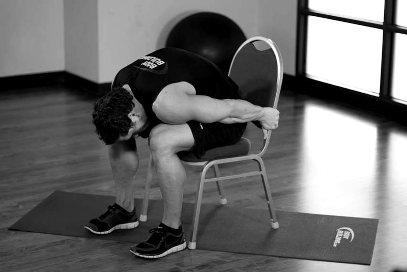 Chair Upper Body Stretch — end position demonstration photo