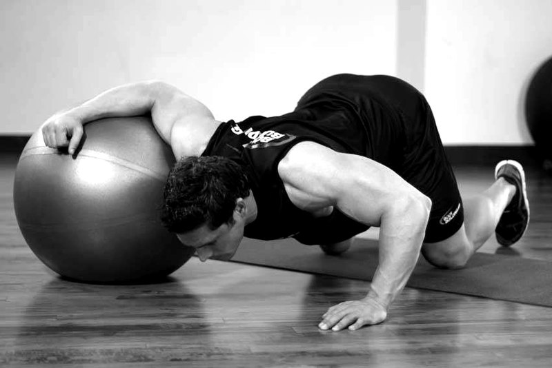 Chest Stretch on Stability Ball — start position demonstration photo
