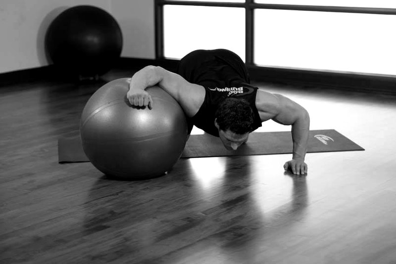 Chest Stretch on Stability Ball — end position demonstration photo