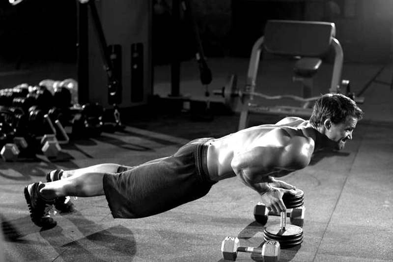 Close-Grip Push-Up off of a Dumbbell — end position demonstration photo