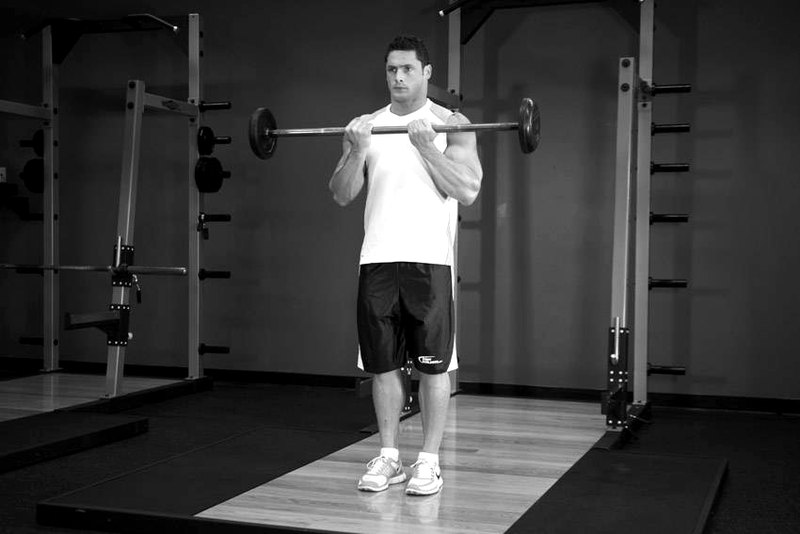 Close-Grip Standing Barbell Curl — end position demonstration photo