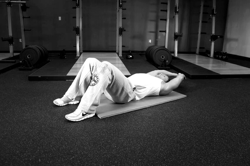 Crunch - Hands Overhead — start position demonstration photo