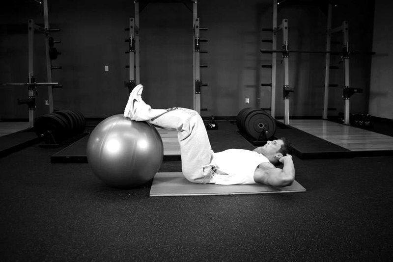 Crunch - Legs On Exercise Ball — start position demonstration photo