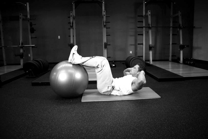 Crunch - Legs On Exercise Ball — end position demonstration photo