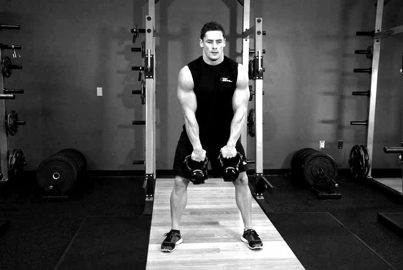 Double Kettlebell Alternating Hang Clean — start position demonstration photo