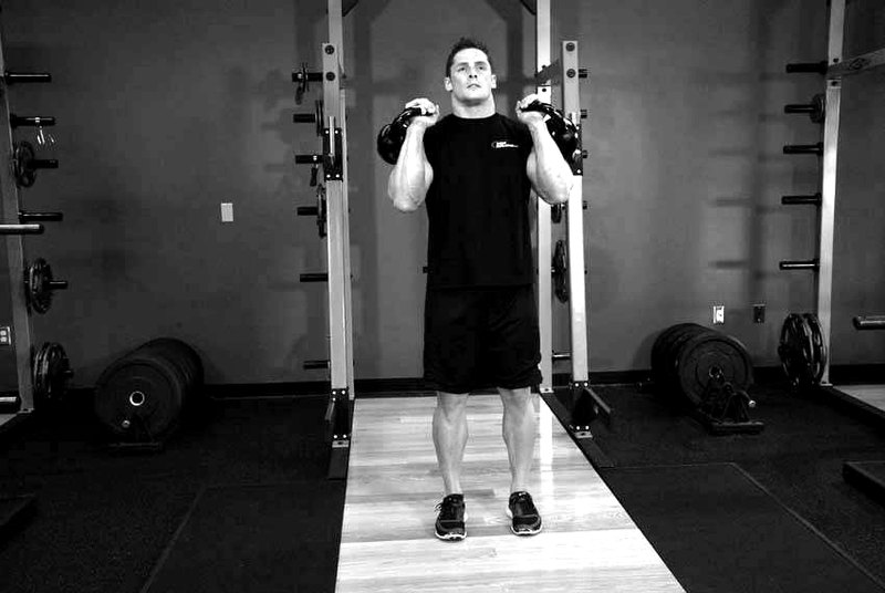 Double Kettlebell Jerk — start position demonstration photo