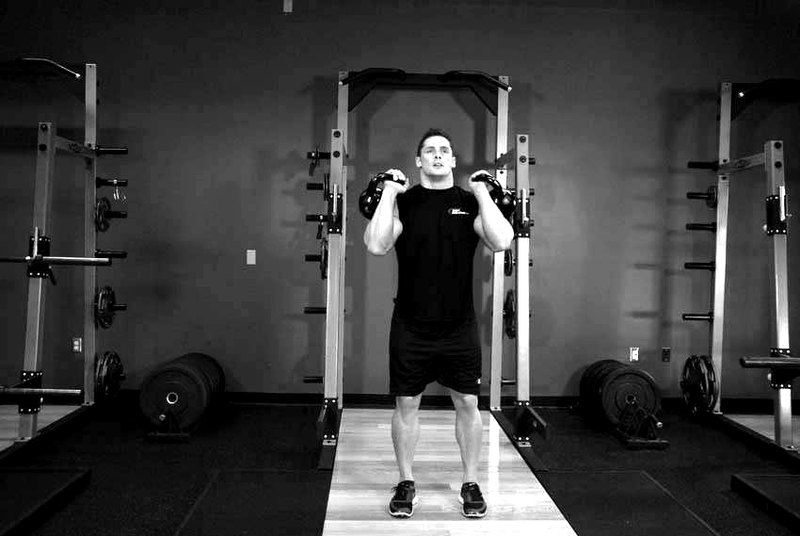 Double Kettlebell Push Press — start position demonstration photo