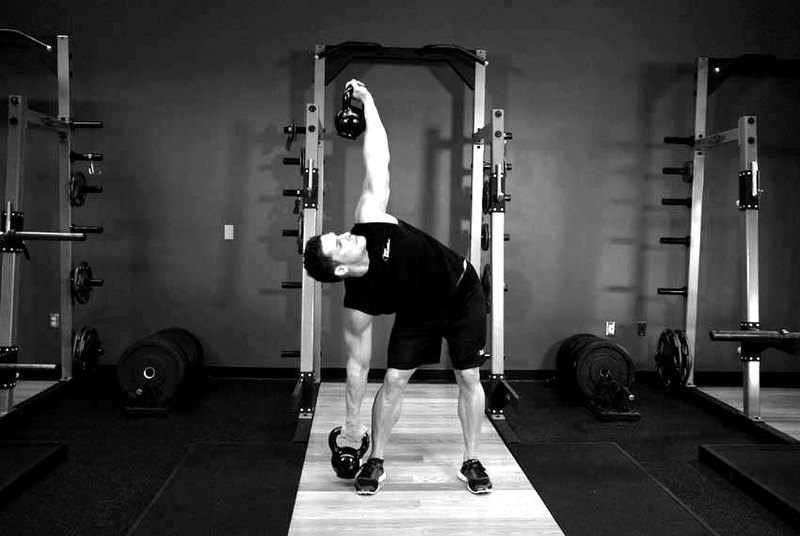 Double Kettlebell Windmill — end position demonstration photo