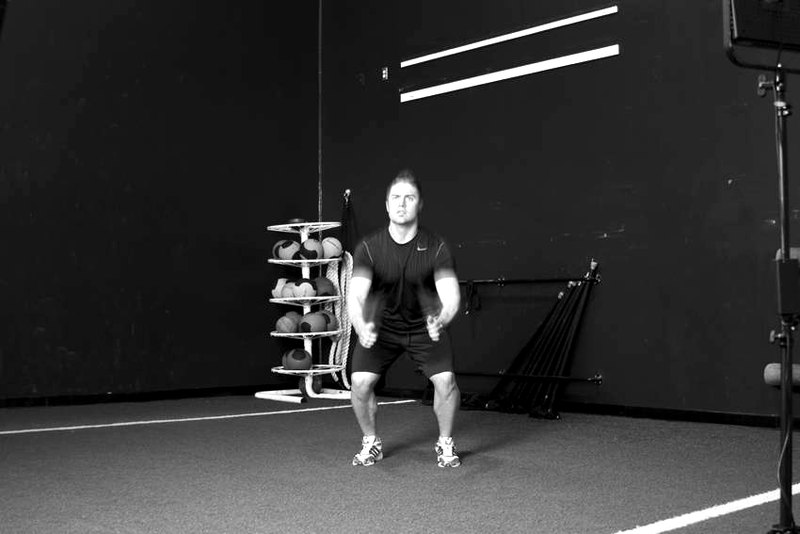 Double Leg Butt Kick — start position demonstration photo