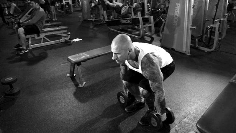 Dumbbell Clean — start position demonstration photo