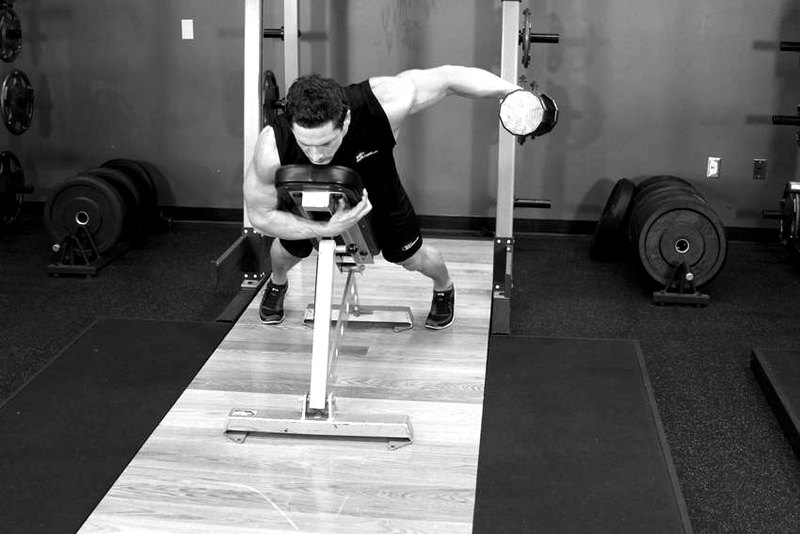 Dumbbell Lying One-Arm Rear Lateral Raise — end position demonstration photo