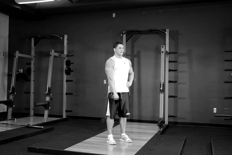 Dumbbell One-Arm Upright Row — end position demonstration photo