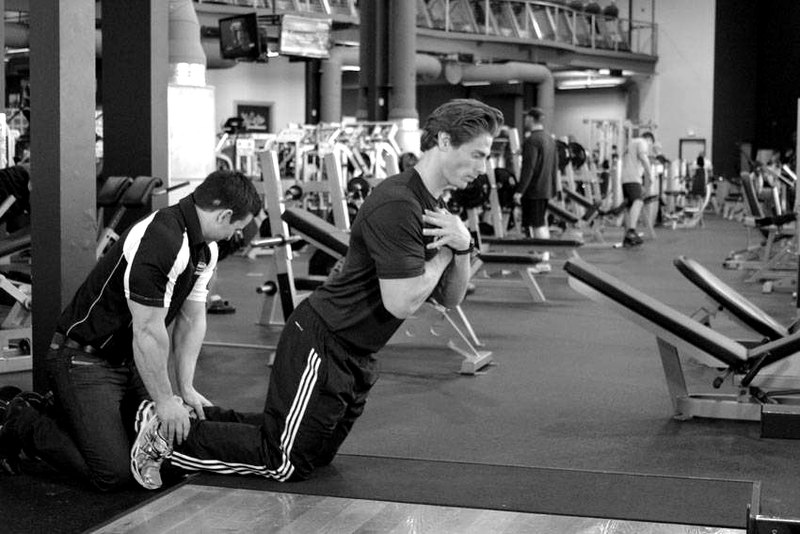 Floor Glute-Ham Raise — end position demonstration photo