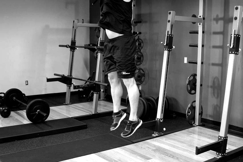 Freehand Jump Squat — end position demonstration photo