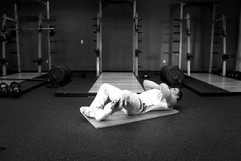 Frog Sit-Ups — start position demonstration photo