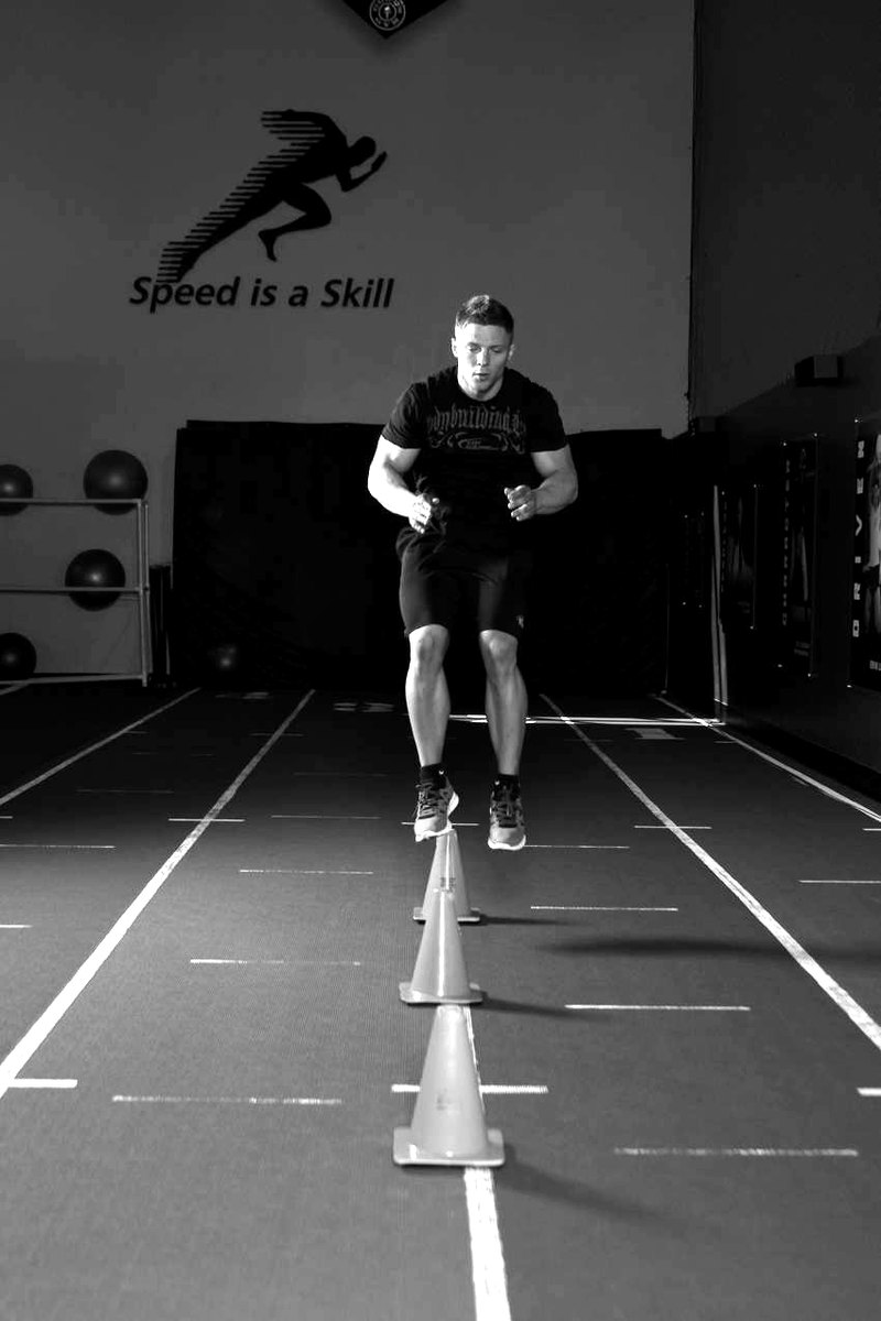 Front Cone Hops (or hurdle hops) — end position demonstration photo