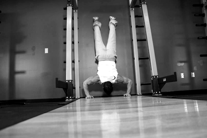 Handstand Push-Ups — end position demonstration photo