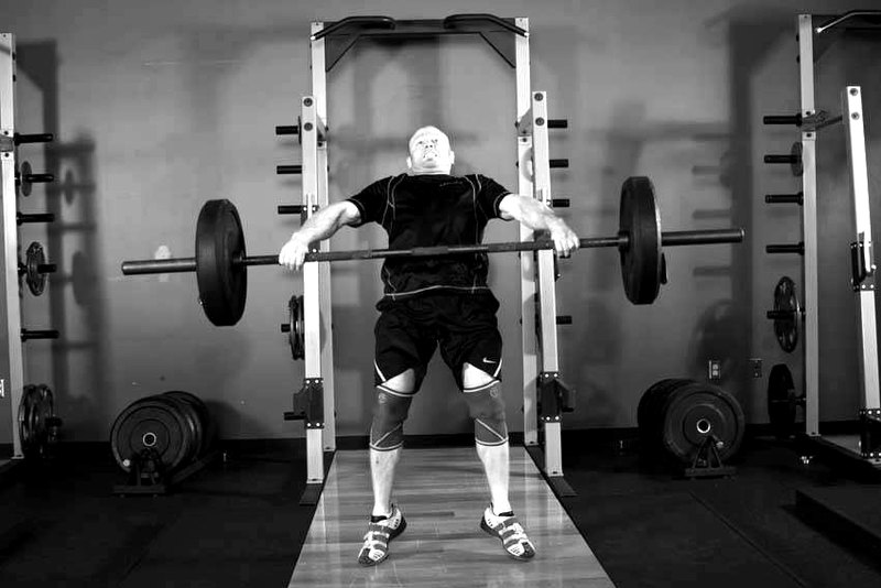Hang Snatch - Below Knees — end position demonstration photo