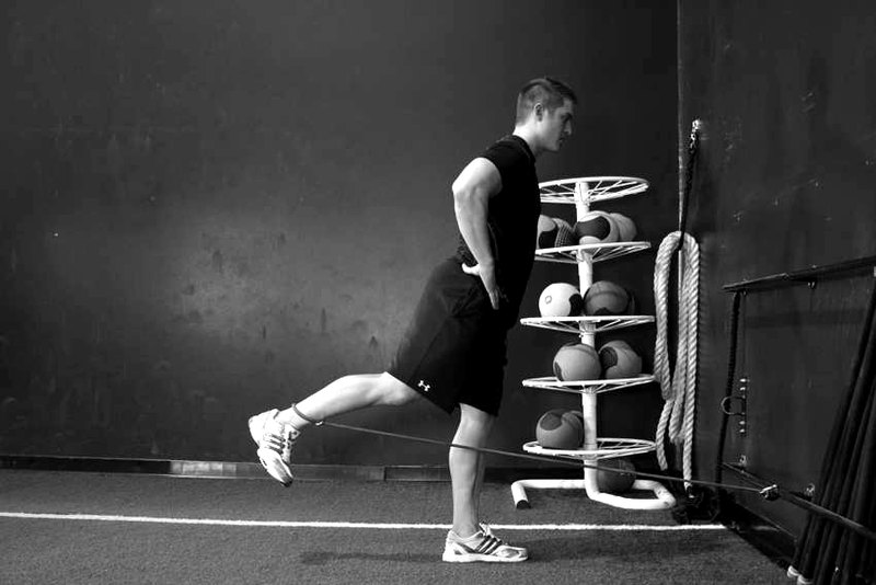 Hip Extension with Bands — end position demonstration photo