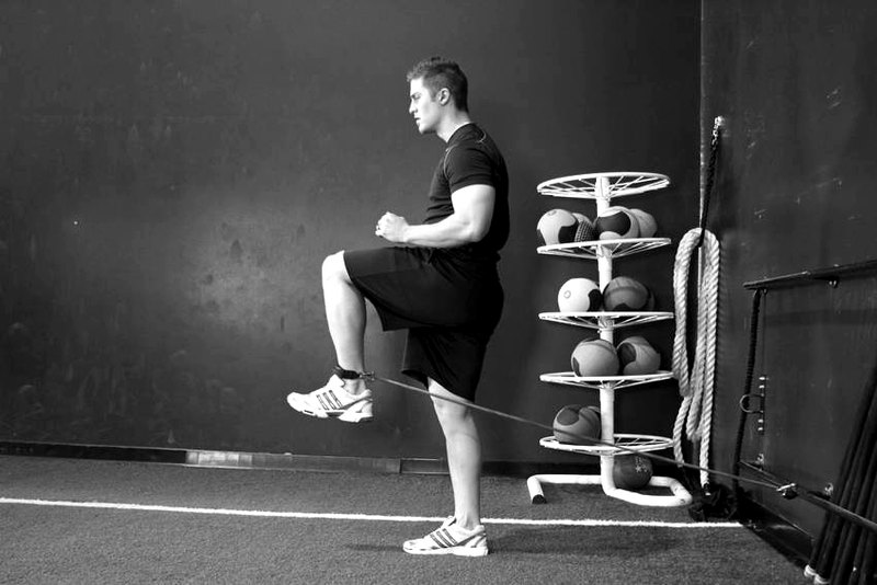Hip Flexion with Band — end position demonstration photo