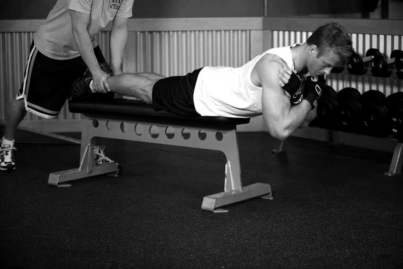 Hyperextensions With No Hyperextension Bench — end position demonstration photo