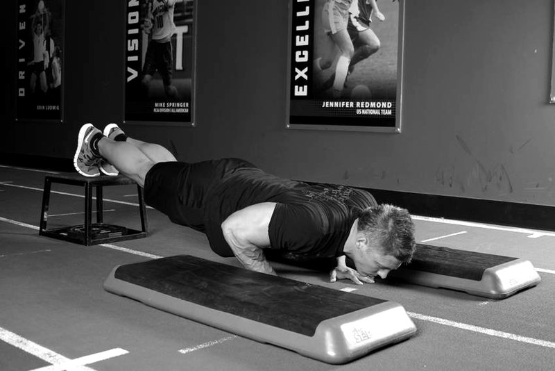 Incline Push-Up Depth Jump — start position demonstration photo