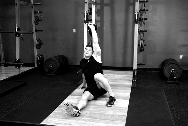 Kettlebell Turkish Get-Up (Squat style) — end position demonstration photo