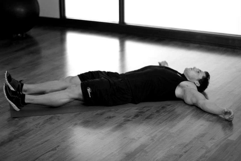 Knee Across The Body — start position demonstration photo