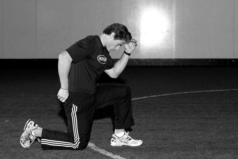 Kneeling Arm Drill — end position demonstration photo