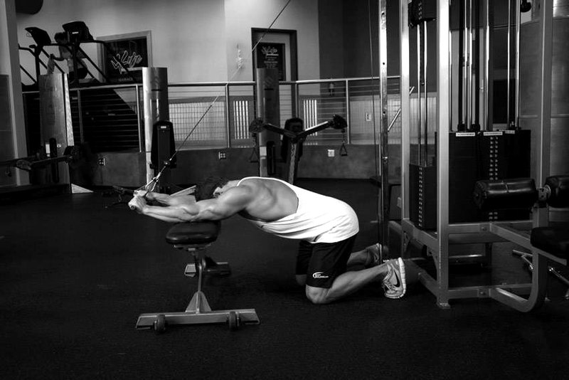 Kneeling Cable Triceps Extension — end position demonstration photo